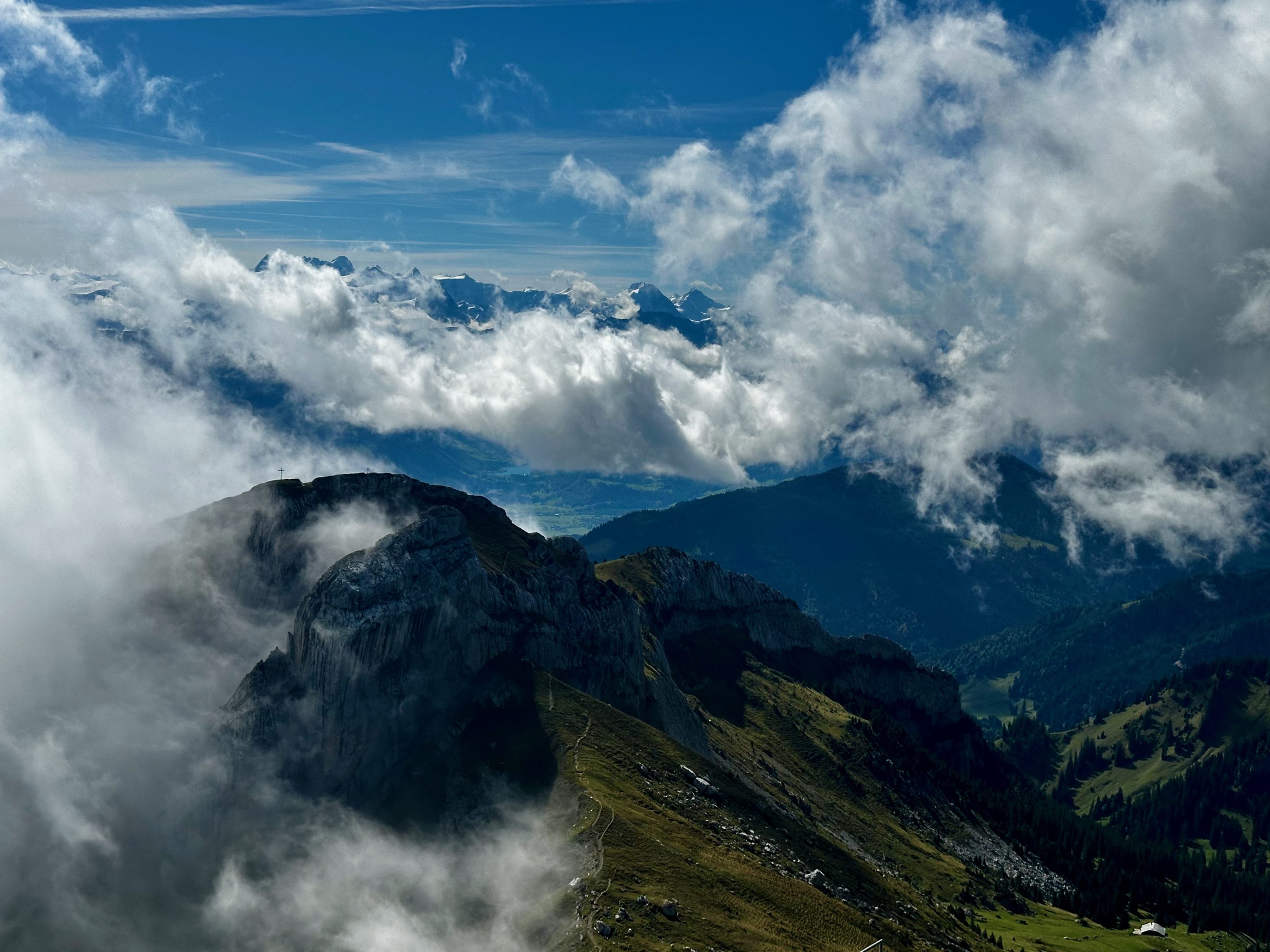 Mountain peaks rising above a sea of cloud in the Swiss Alps